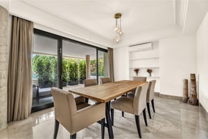 Bright dining room with natural light and direct access to the terrace in luxury apartment
