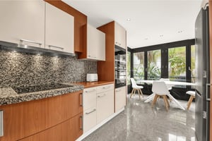 Bright kitchen with built-in appliances and garden-facing breakfast nook