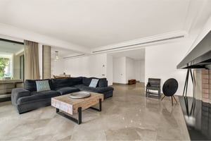 Elegant hallway with marble floors and recessed lighting in Los Monteros Park apartment